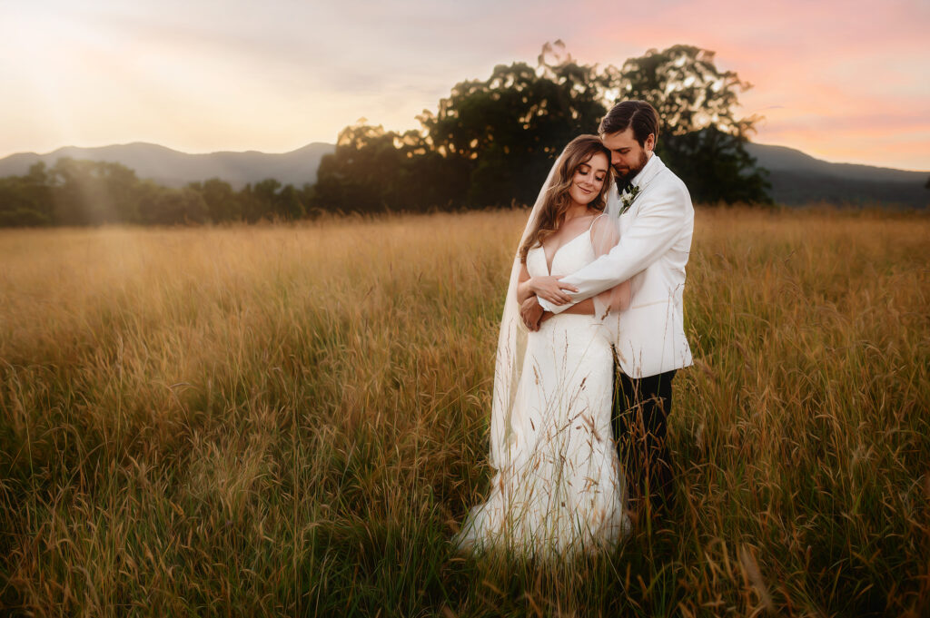 Newlyweds embrace n their Wedding Day at The Farm, A Gathering Place in Asheville, NC.